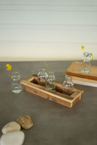 Set of five glass bud vases with recycled wood base